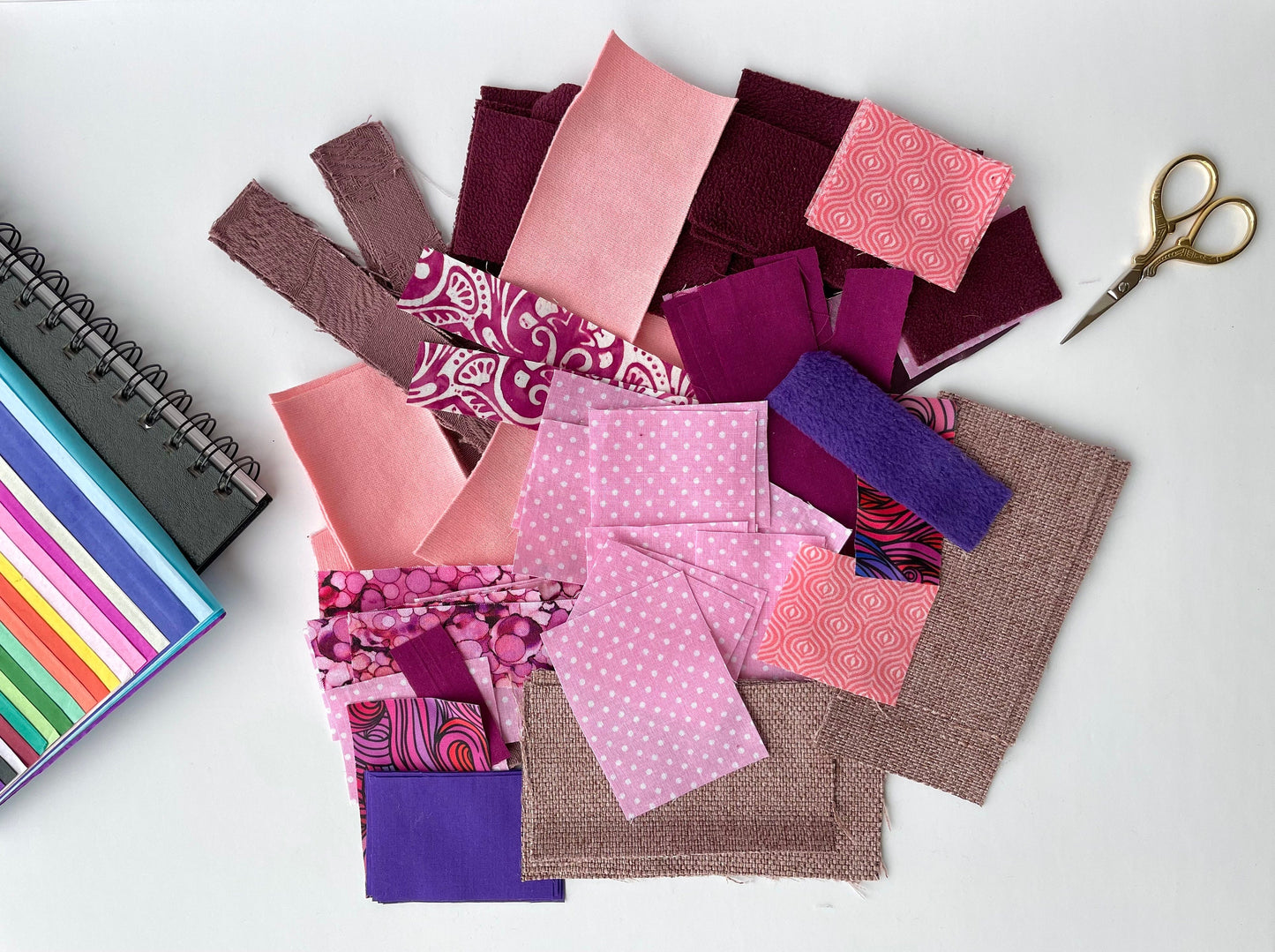 Craft fabric samples in pink and purple in assorted patterns and fibre types. Use for projects like doll costumes, childrens art projects, slow stitching