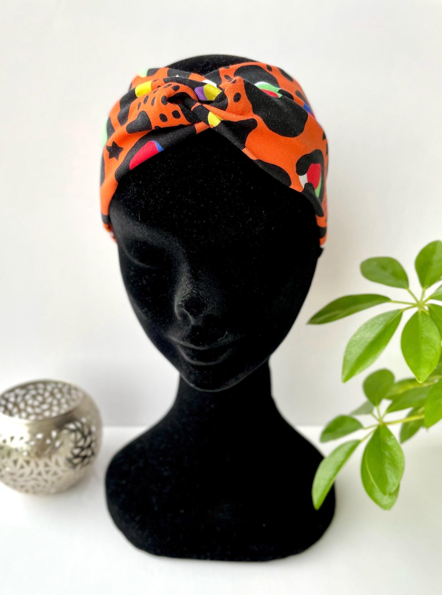Orange leopard print stretch bandeau headband with crossover. Handmade in Ireland from upcycled fabric.