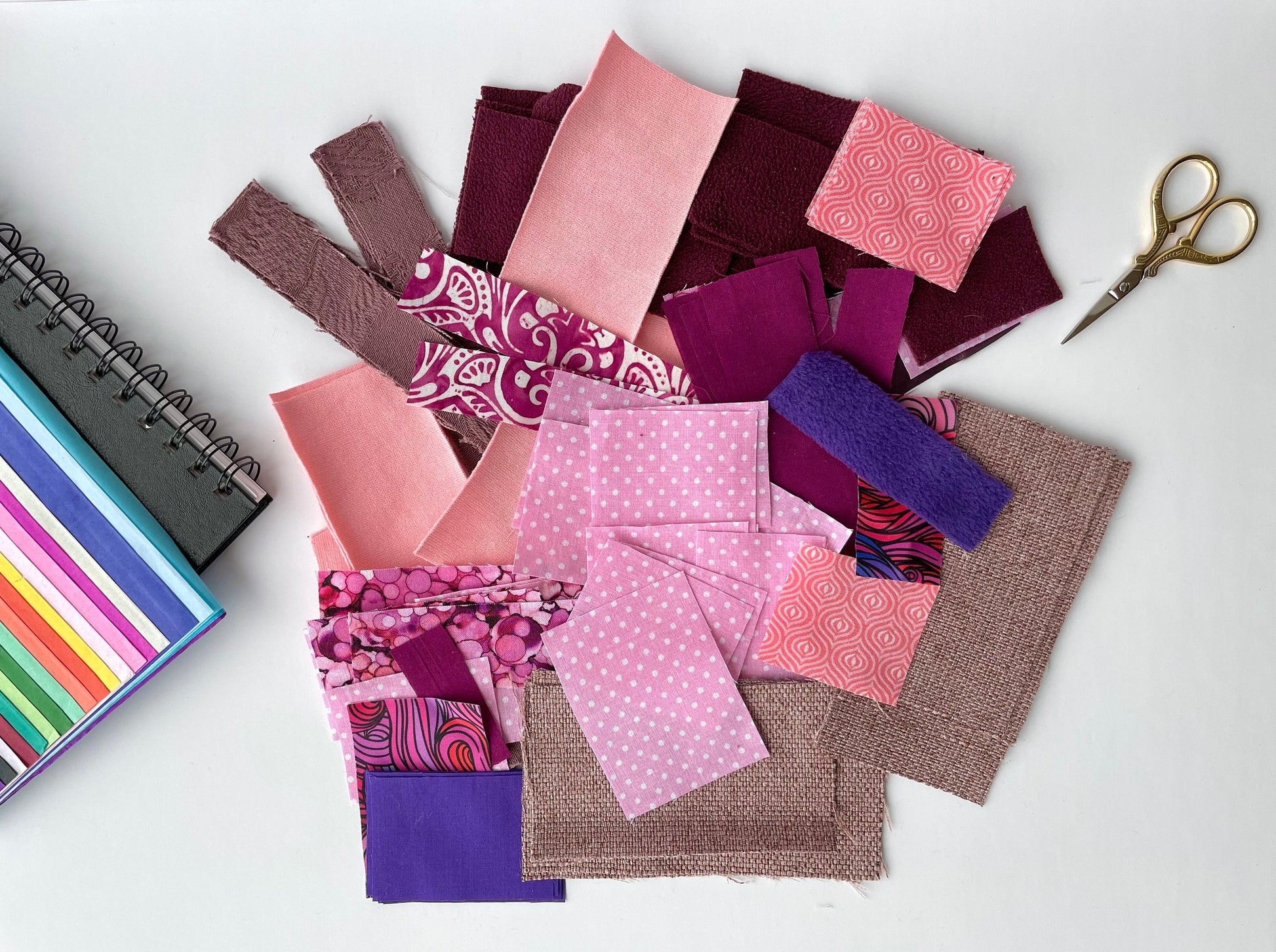 Craft fabric samples in pink and purple in assorted patterns and fibre types. Use for projects like doll costumes, childrens art projects, slow stitching