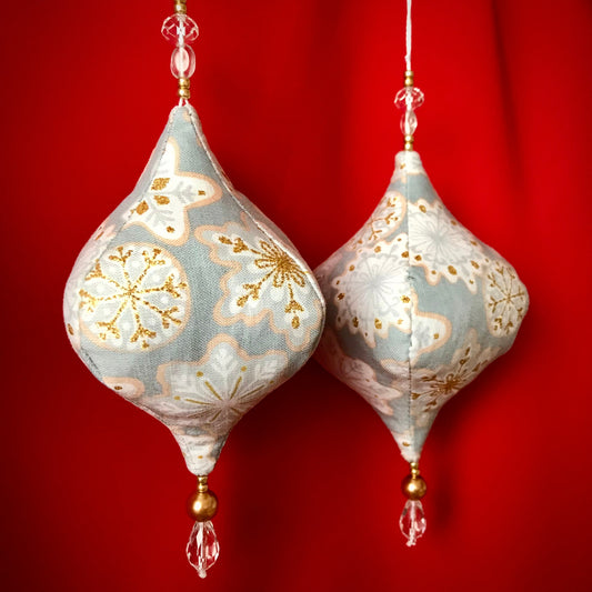 Fabric jewel shape Christmas ornaments handmade with upcycled fill. Gold and grey snowflake pattern fabric, two are shown.