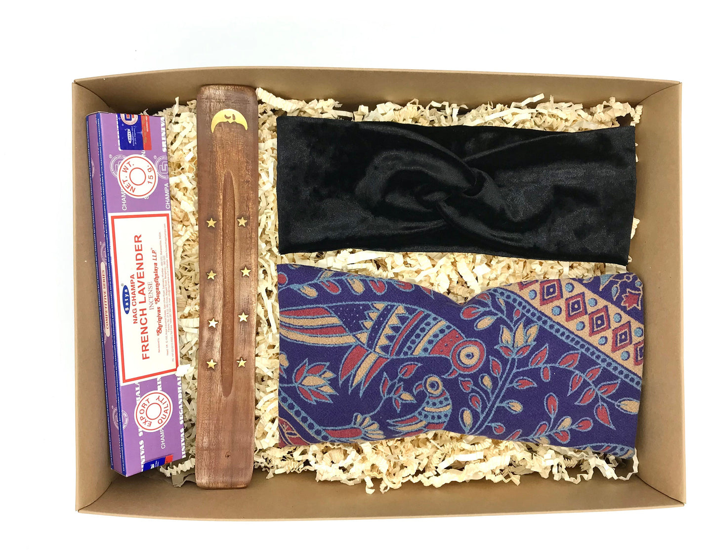 Yoga gift set featuring upcycled bird pattern weighted eye pillow, black stretch headband and lavender incense set. Vegan friendly and all items are ethically made.