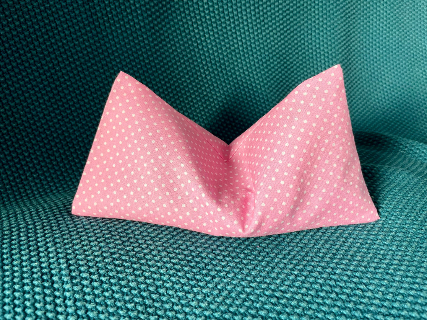 Pink weighted eye pillow with white polka dots. Best weighted eye pillow handmade in Ireland.