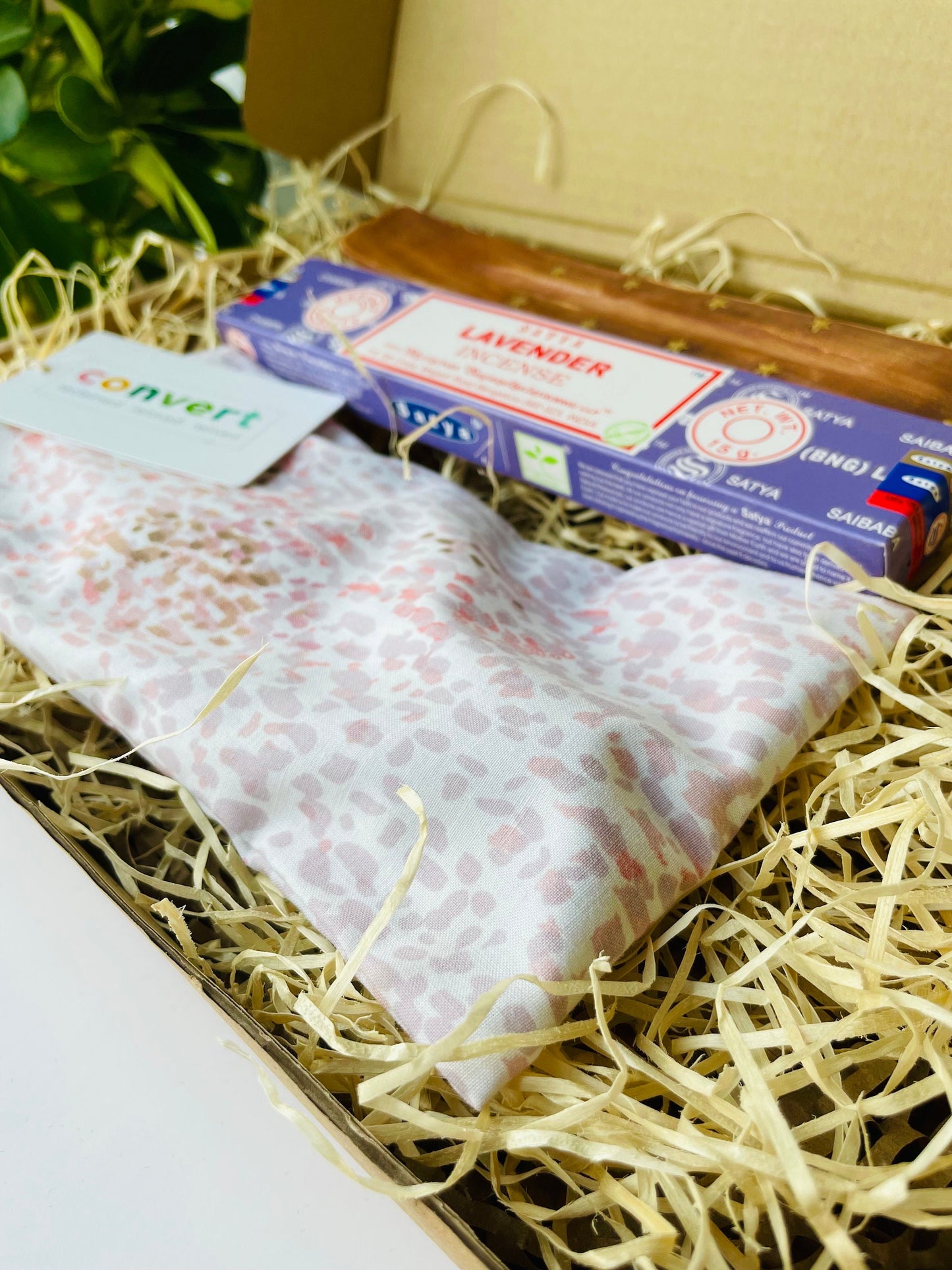 small yoga gift hamper for relaxation with pink weighted eye pillow and lavender incense set